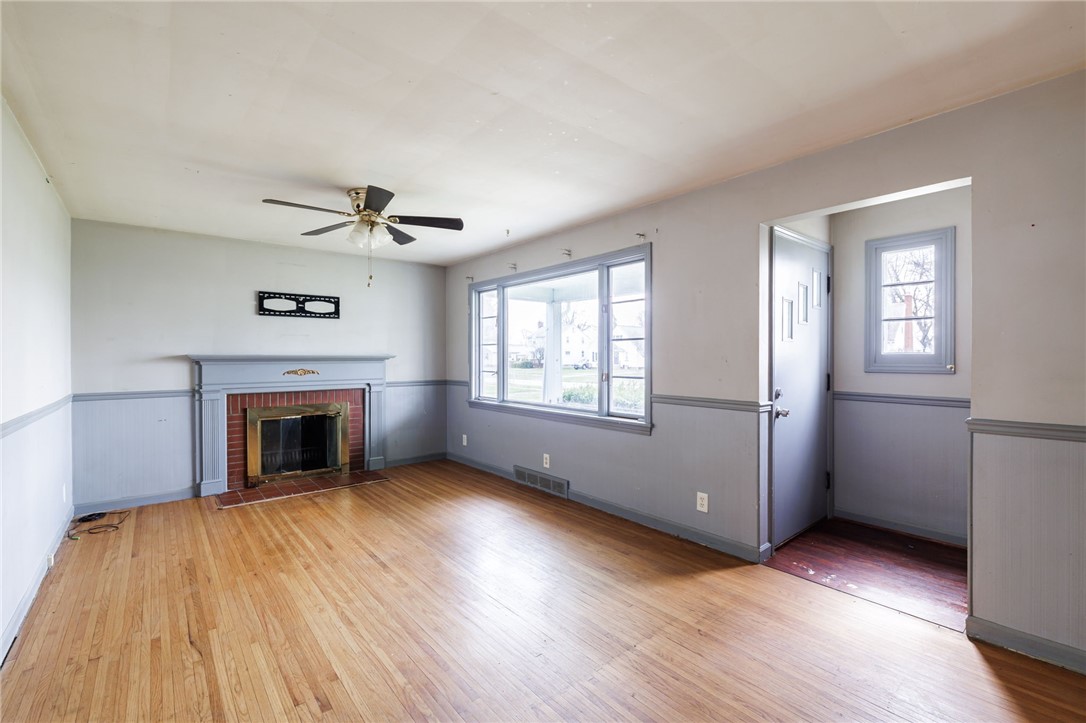 246 Thorndyke Road Irondequoit, NY 14617 - Photo 4 of 27 Living Room with wood burning fireplace