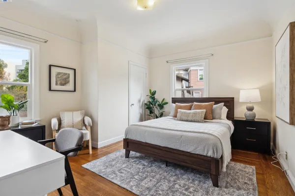 a bedroom with a bed and a couch