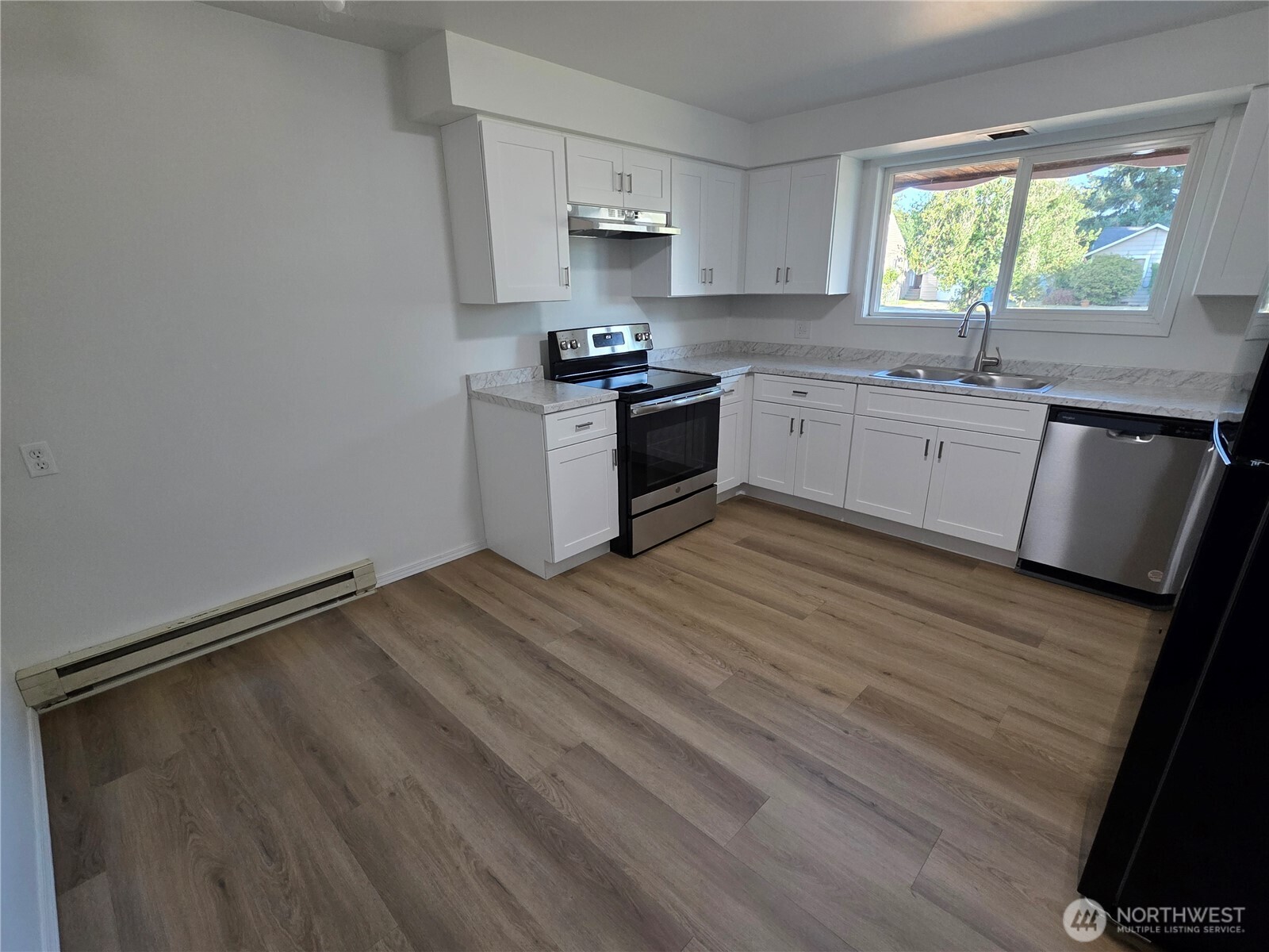 620 North Street Monroe, WA 98272 - Photo 27 of 38 a kitchen with a sink window and cabinets