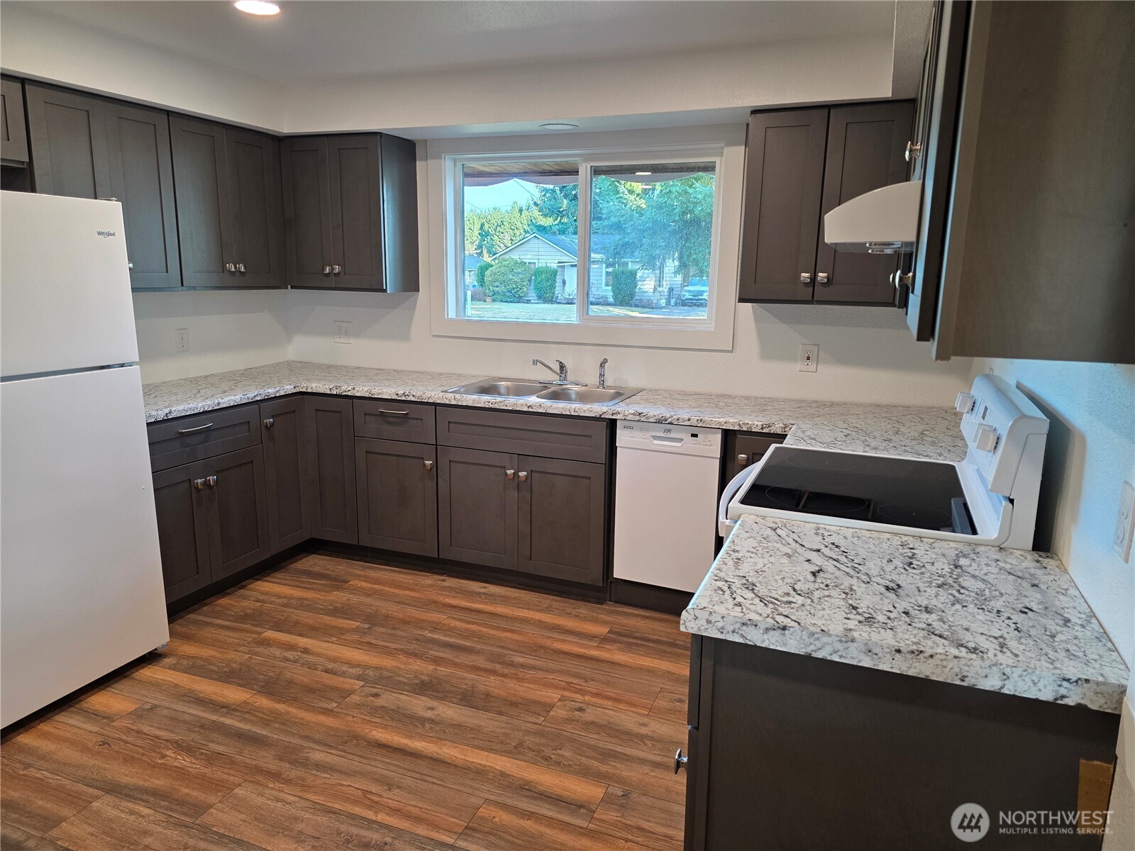 620 North Street Monroe, WA 98272 - Photo 10 of 38 a kitchen with a sink stove and refrigerator