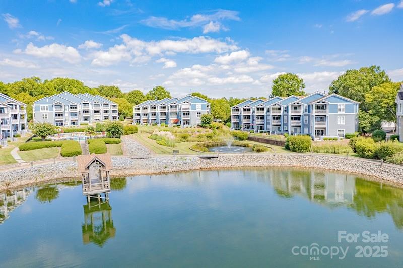 1125 Torrence Circle Davidson, NC 28036 - Photo 1 of 41 a swimming pool with a city view