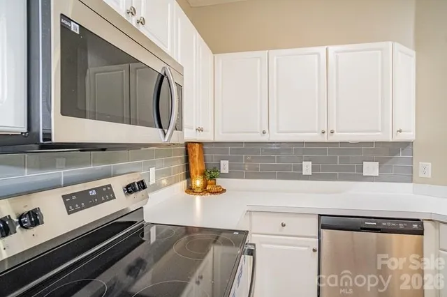 a kitchen with a stove and a microwave