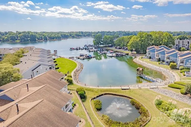 a view of a swimming pool with a patio and a garden