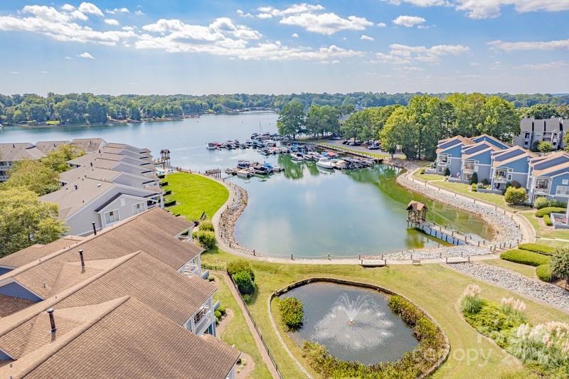 1125 Torrence Circle Davidson, NC 28036 - Photo 34 of 41 a view of a swimming pool with a patio and a garden