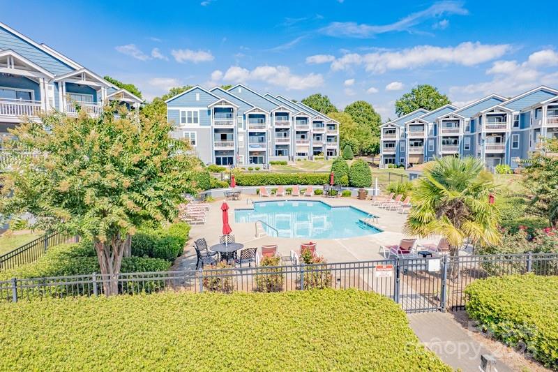 1125 Torrence Circle Davidson, NC 28036 - Photo 37 of 41 a view of a building with a garden and sitting area