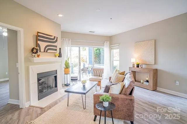 a living room with furniture and a fireplace