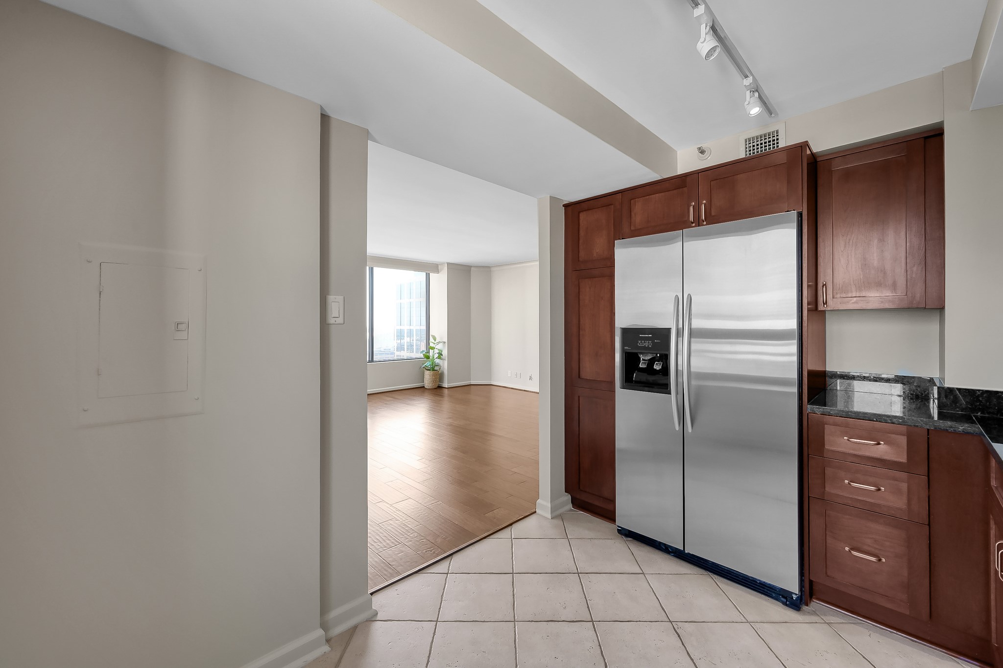1111 Caroline Street, Unit 2901 Houston, TX 77010 - Photo 16 of 46 a kitchen with a refrigerator and cabinets