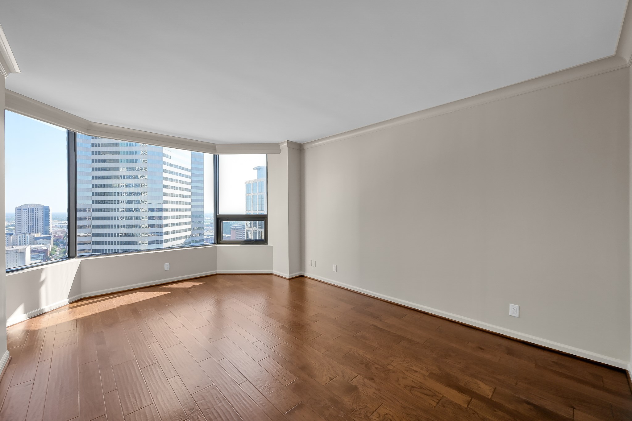 1111 Caroline Street, Unit 2901 Houston, TX 77010 - Photo 17 of 46 a view of wooden floor and windows in a room