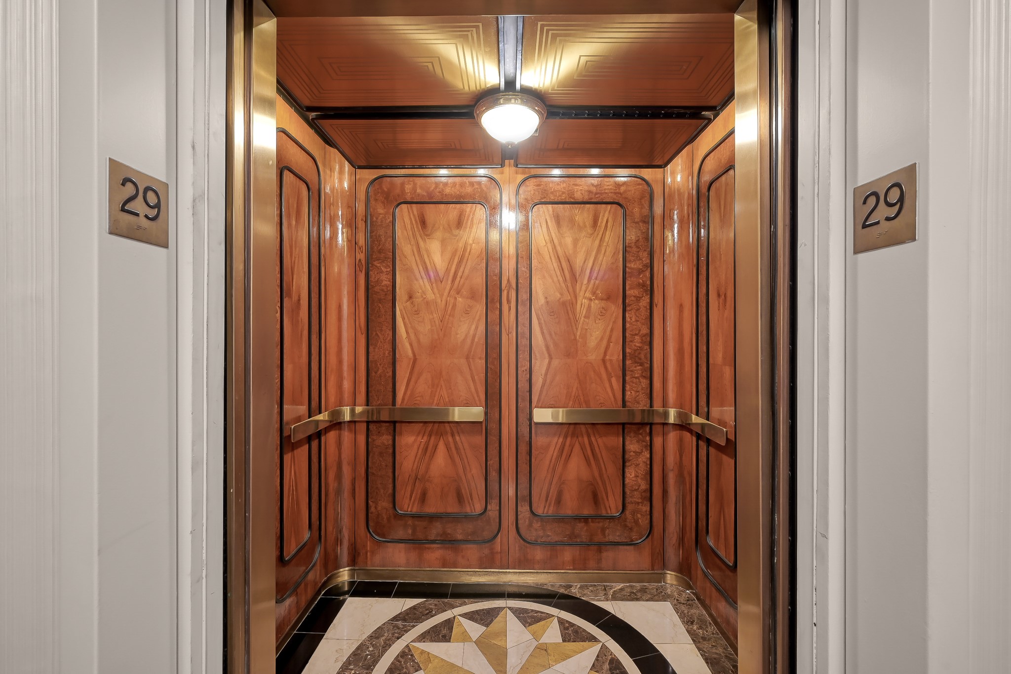 1111 Caroline Street, Unit 2901 Houston, TX 77010 - Photo 24 of 46 a view of a hallway with a chandelier