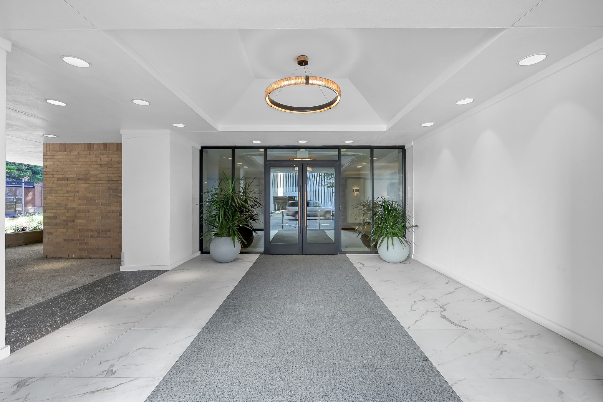 1111 Caroline Street, Unit 2901 Houston, TX 77010 - Photo 3 of 46 a view of a hallway with an entryway and wooden floor