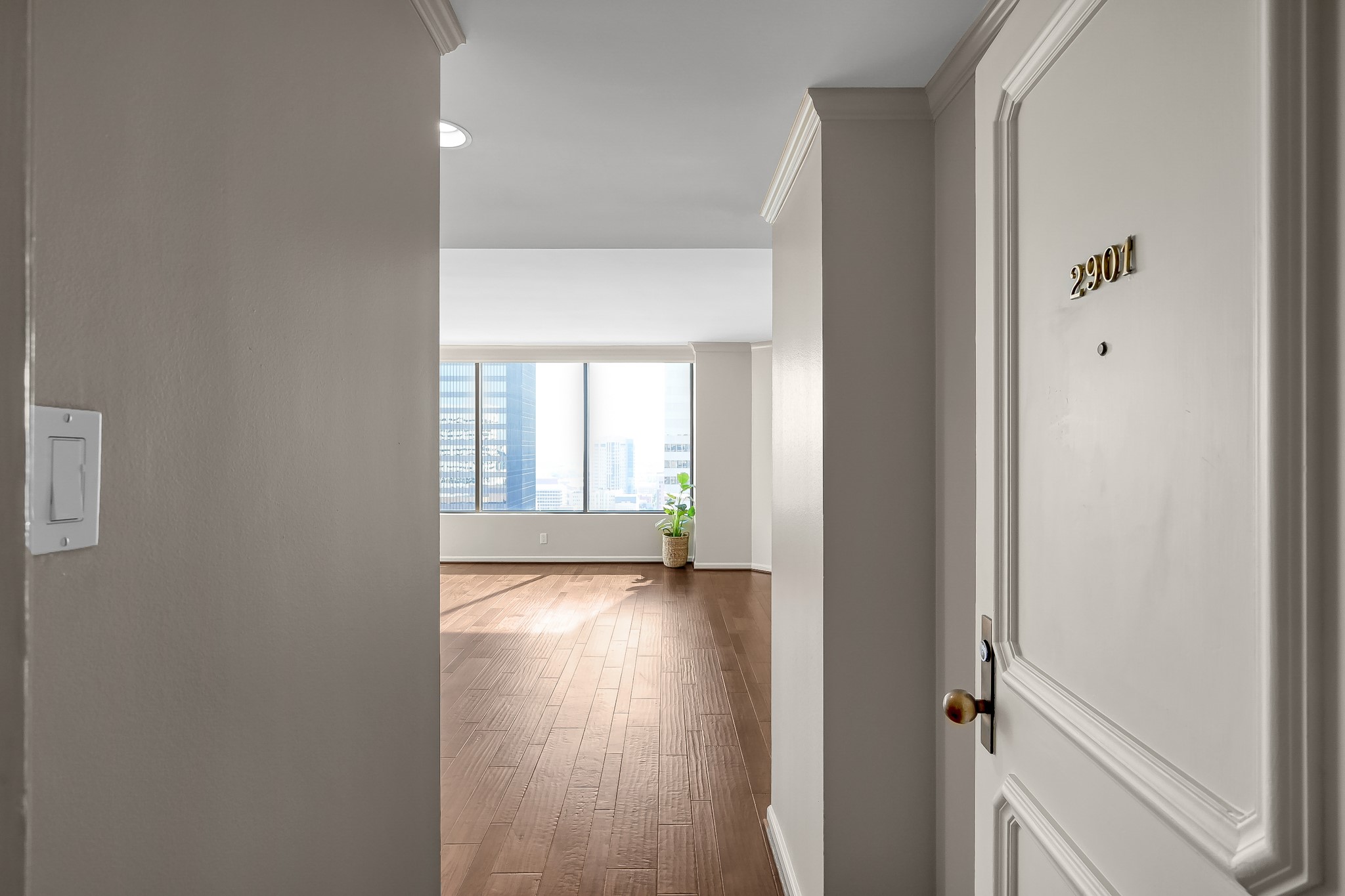 1111 Caroline Street, Unit 2901 Houston, TX 77010 - Photo 8 of 46 an empty room with wooden floor and windows