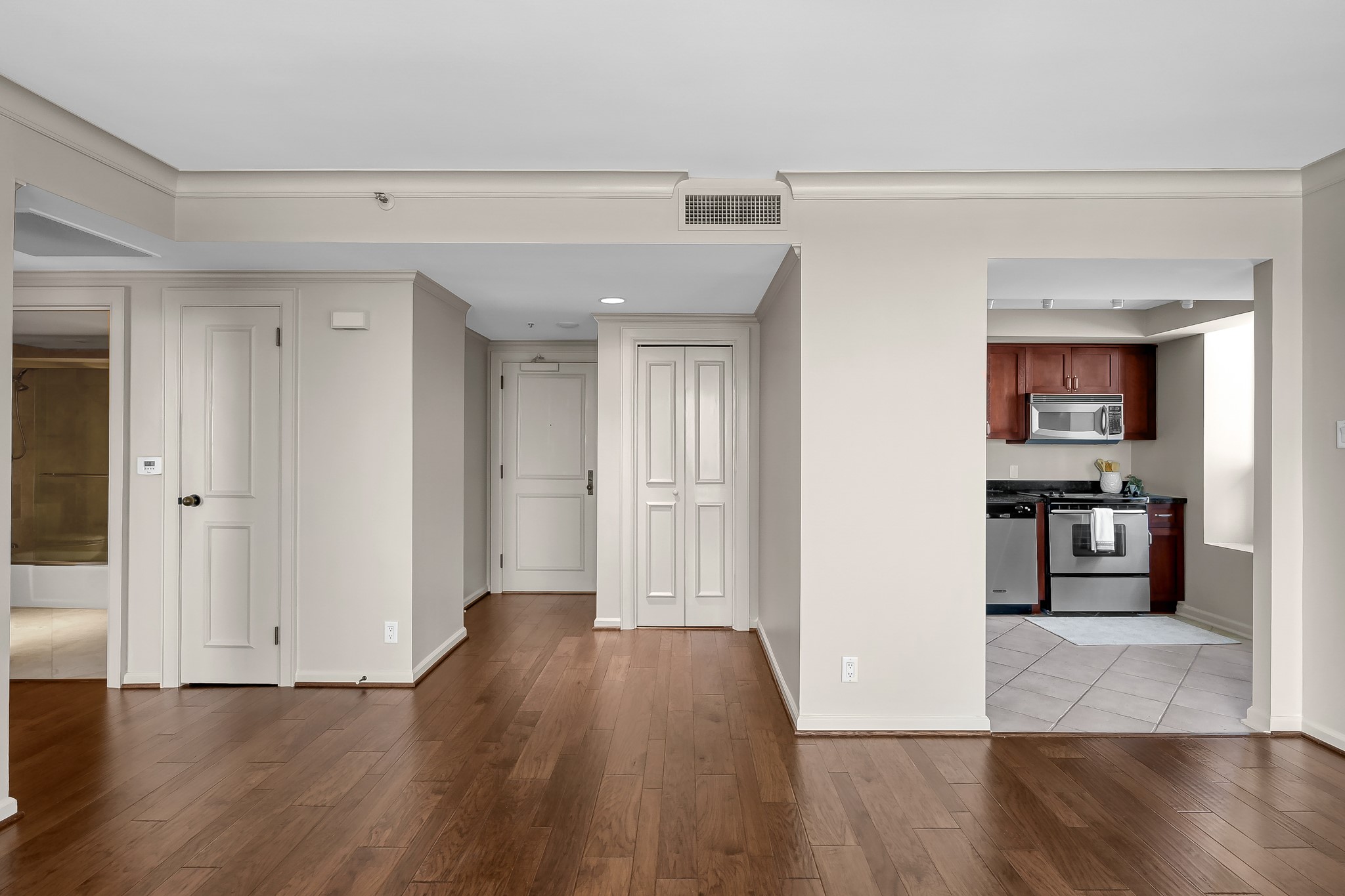1111 Caroline Street, Unit 2901 Houston, TX 77010 - Photo 9 of 46 a view of a kitchen with wooden floor