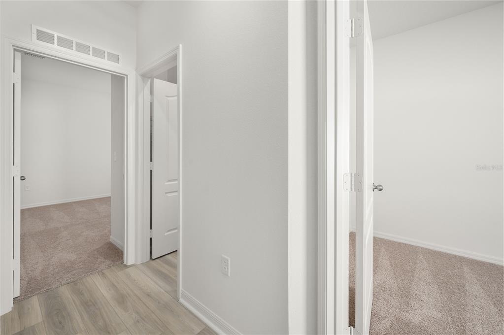13261 Tula Loop Astatula, FL 34705 - Photo 14 of 25 a view of a room with wooden floor