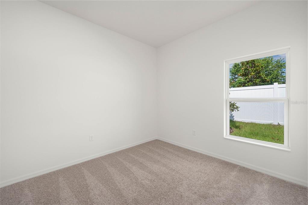 13261 Tula Loop Astatula, FL 34705 - Photo 18 of 25 an empty room with a window