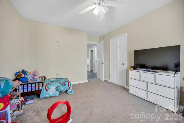 a view of a livingroom with furniture and a flat screen tv