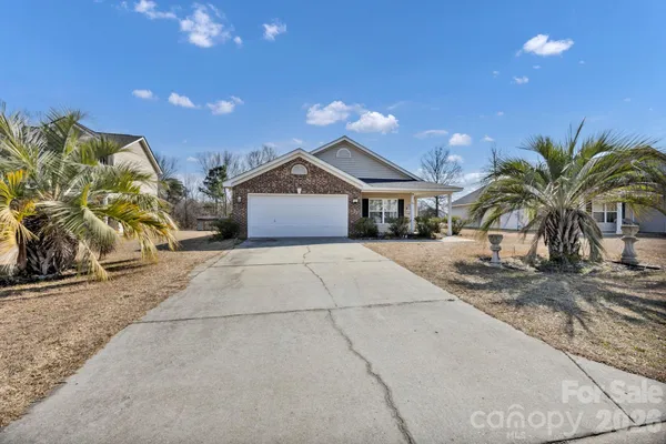 a house with palm tree in front of it