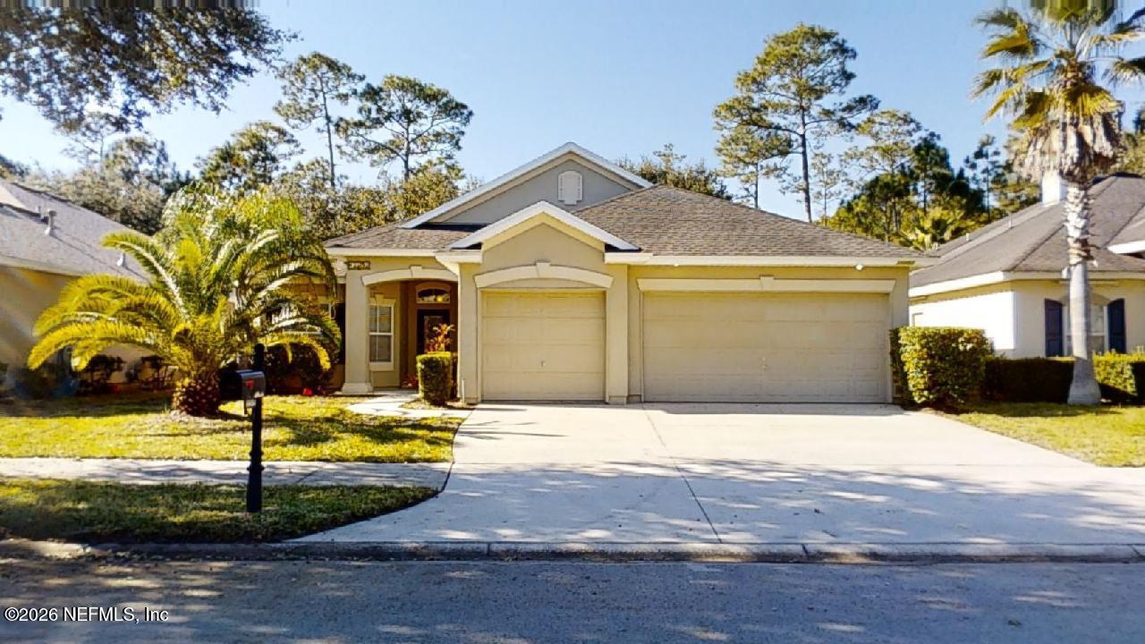 14454 Millhopper Road Jacksonville, FL 32258 - Photo 1 of 44 a view of a house with swimming pool