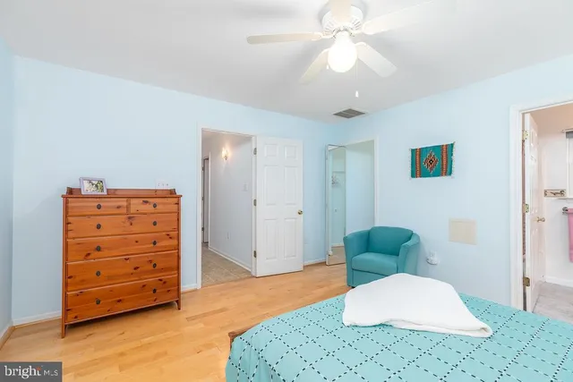 a living room with furniture and a dresser