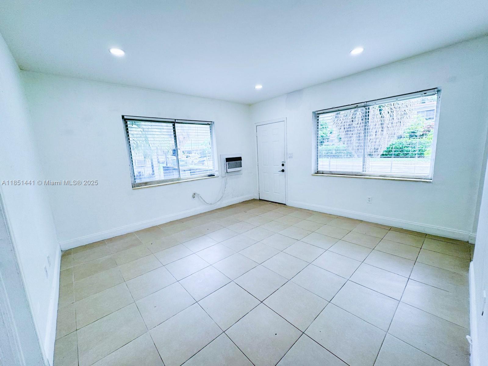 2499 Southwest 27th Street, Unit 9 Miami, FL 33133 - Photo 13 of 19 a view of an empty room with a window