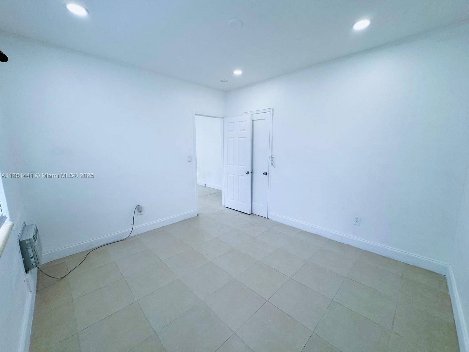 2499 Southwest 27th Street, Unit 9 Miami, FL 33133 - Photo 14 of 19 a view of an empty room