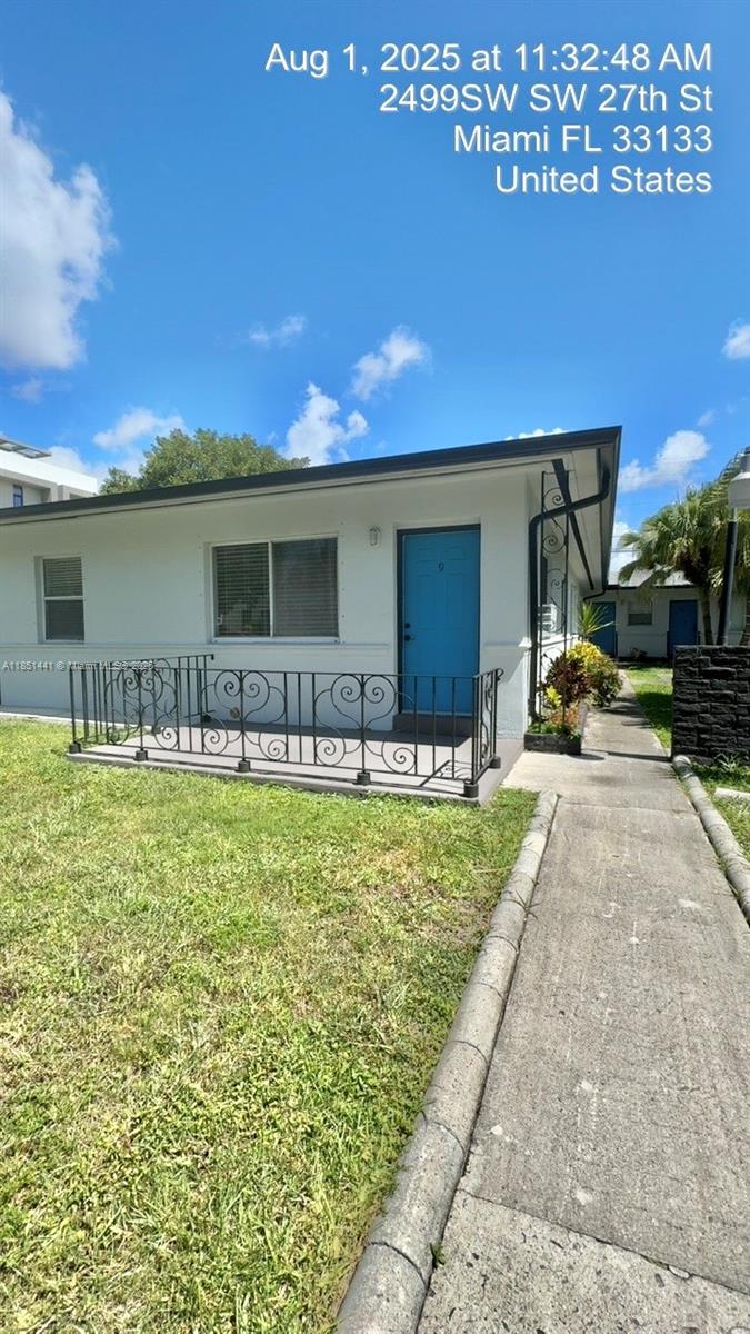 2499 Southwest 27th Street, Unit 9 Miami, FL 33133 - Photo 4 of 19 a house view with a outdoor space