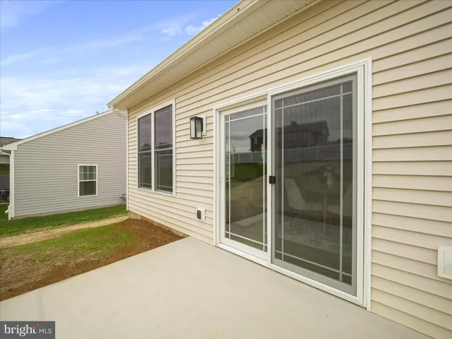 a view of a sign board with a yard