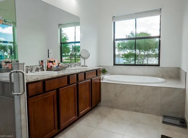 a bathroom with a bathtub and sink
