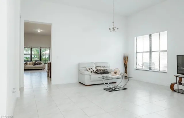 a dining room with furniture and a wooden floor