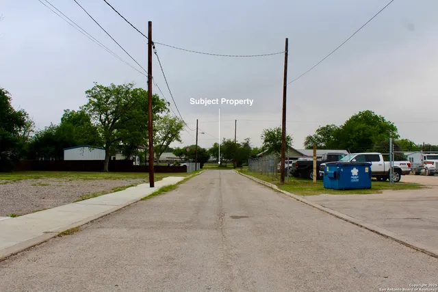 a view of a house with outdoor space and sitting area