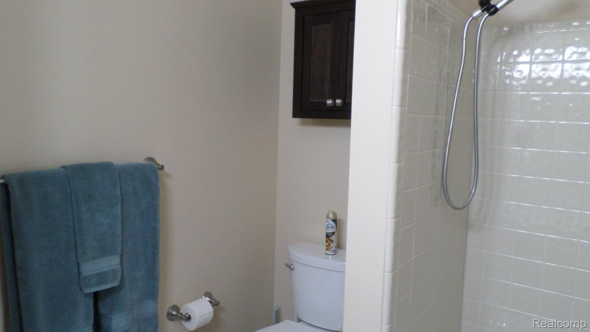 33831 Hooker Road, Unit 6 New Baltimore, MI 48047 - Photo 16 of 34 Bathroom featuring a tile shower and toilet
