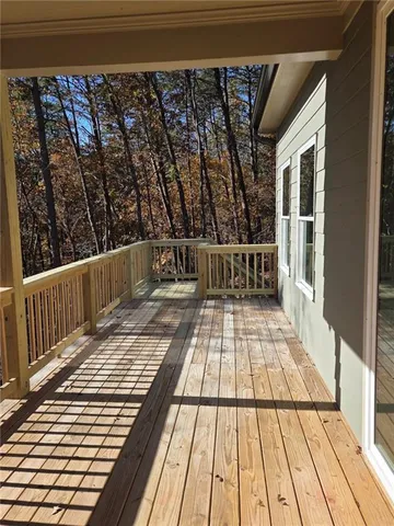 a view of balcony with wooden floor