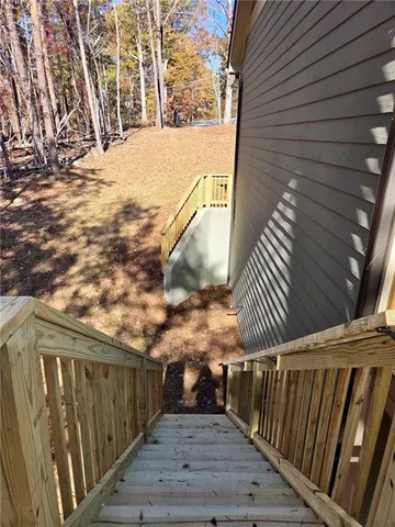 a view of balcony with wooden floor