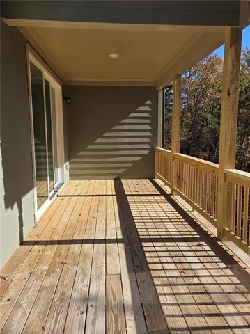 a view of balcony with wooden floor