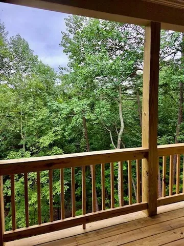 a view of balcony with wooden floor