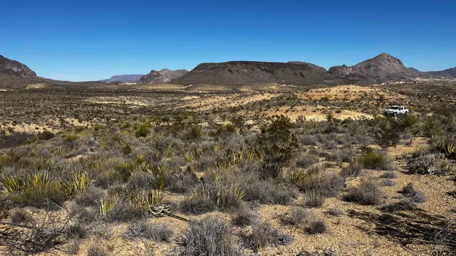 a view of a mountain range in a cloudy sky