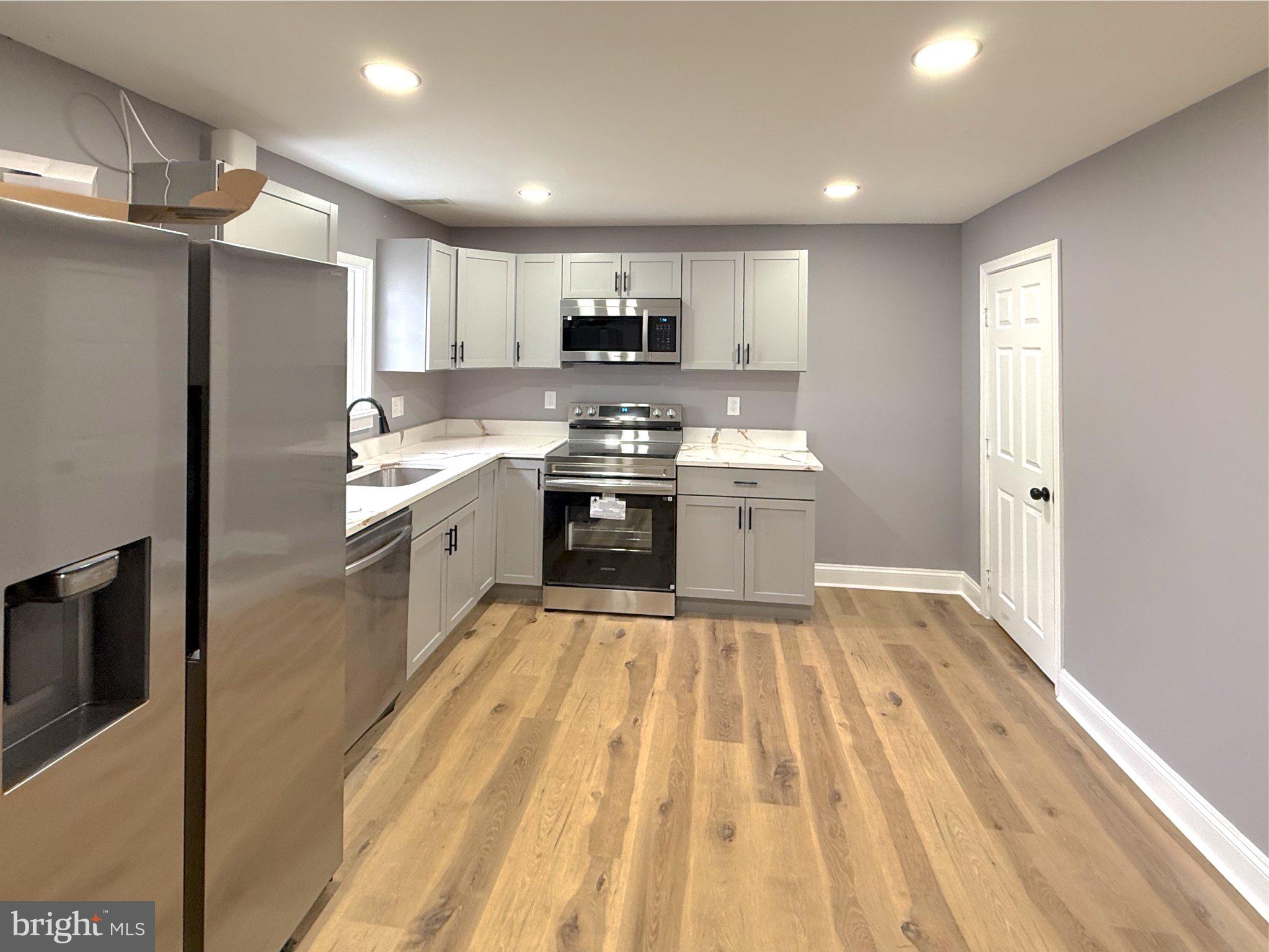 3703 6th Street, Unit 2 Baltimore, MD 21225 - Photo 2 of 20 Modern kitchen with sleek finishes.