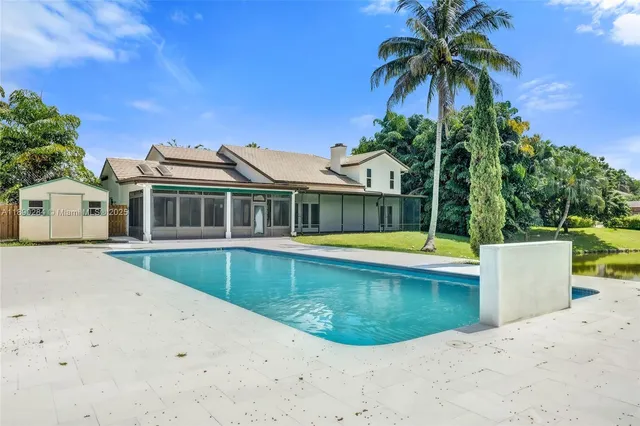 a view of a house with a swimming pool