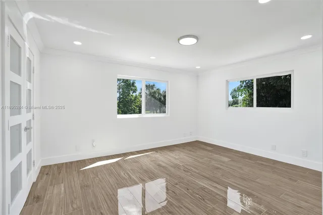 a bathroom with a shower sink and mirror