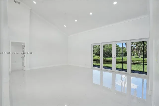 a view of an empty room with a window