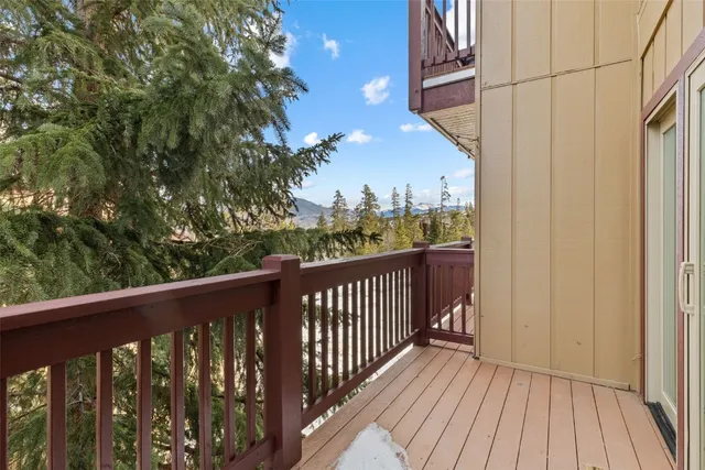 a view of a wooden door and a street sign