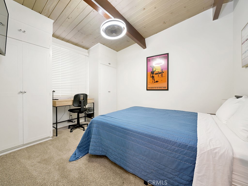 129 45th Street Newport Beach, CA 92663 - Photo 13 of 38 a bed room with a bed and a chair