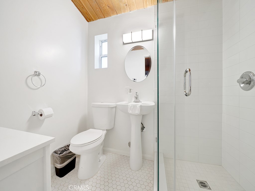 129 45th Street Newport Beach, CA 92663 - Photo 24 of 38 a bathroom with a toilet sink and shower