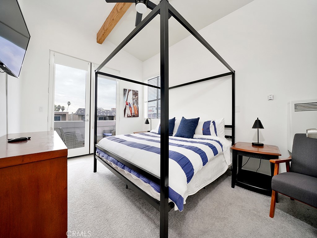 129 45th Street Newport Beach, CA 92663 - Photo 30 of 38 a bed room with a bed and a couch