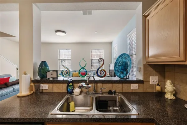 a kitchen with a sink and a stove