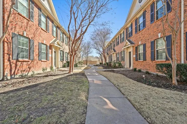 a view of a building with a yard