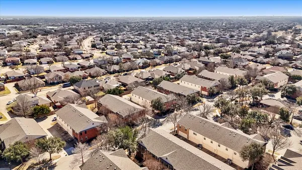 an aerial view of a city with lots of residential buildings
