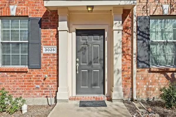 a front view of a house with a glass door