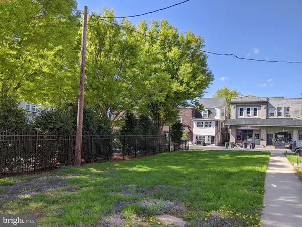 a view of a building with a yard