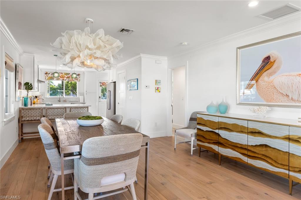 320 14th Avenue South, Unit 320B Naples, FL 34102 - Photo 5 of 14 a dining room with wooden floor and breakfast area