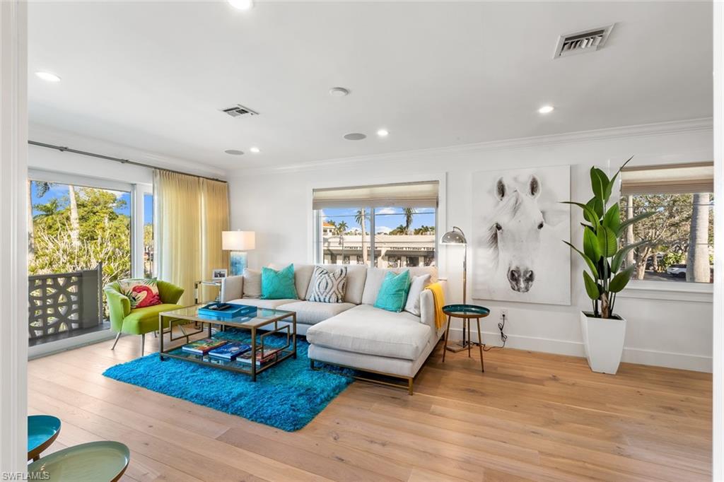 320 14th Avenue South, Unit 320B Naples, FL 34102 - Photo 7 of 14 a living room with furniture and wooden floor